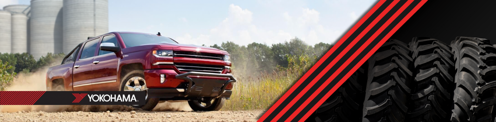 TRUCK DOING DONUTS IN GRAVEL LOT WITH COOP IN BACKGROUND
