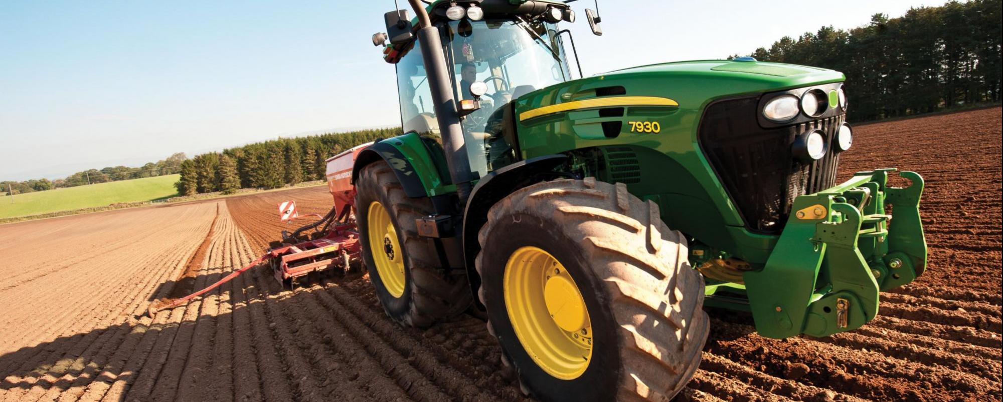 green tractor working in field